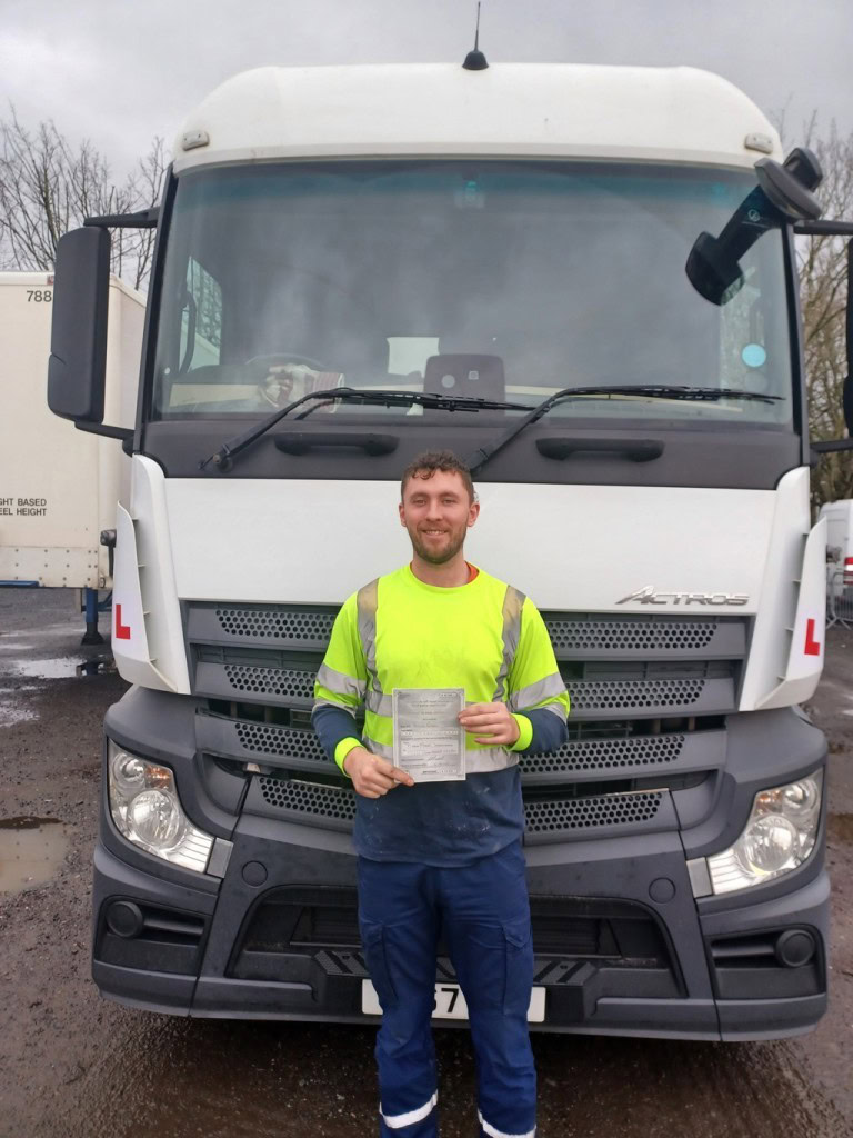 A photo of Connor with his certificate after passing 3A.