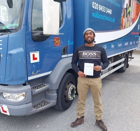 A photograph of Romain on gaining his Cat C certificate via the Thames Freeport training program.