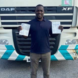 Image of Ismail F with his pass certificates.